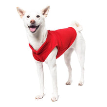 Load image into Gallery viewer, Happy dog wearing a red fleece vest for warmth and comfort during outdoor walks.