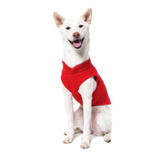 Load image into Gallery viewer, Dog wearing a red fleece vest, showcasing comfort and warmth for outdoor activities.