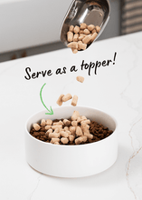 Load image into Gallery viewer, Freeze-dried raw dog food topper being added to a bowl, enhancing mealtime for picky eaters.