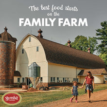 Load image into Gallery viewer, A family walks together outside a barn at Bonnihill Farms, emphasizing homegrown pet food quality.