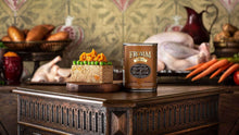 Load image into Gallery viewer, Fromm Turkey, Duck & Sweet Potato Pate can beside a decorated pet food cake on a rustic table with fresh ingredients.
