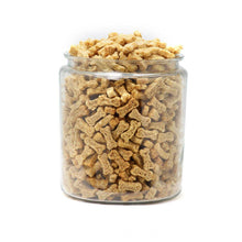 Load image into Gallery viewer, A clear jar filled with Polka Dog bulk dehydrated chicken biscuits in dog bone shapes.