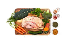 Load image into Gallery viewer, Raw duck surrounded by organic vegetables on a wooden cutting board, perfect for small batch pet meals.