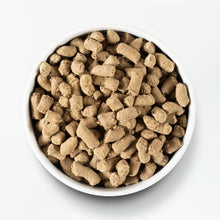 Load image into Gallery viewer, Bowl of Open Farm grass-fed beef freeze dried raw dog food, featuring nutritious kibble pieces.